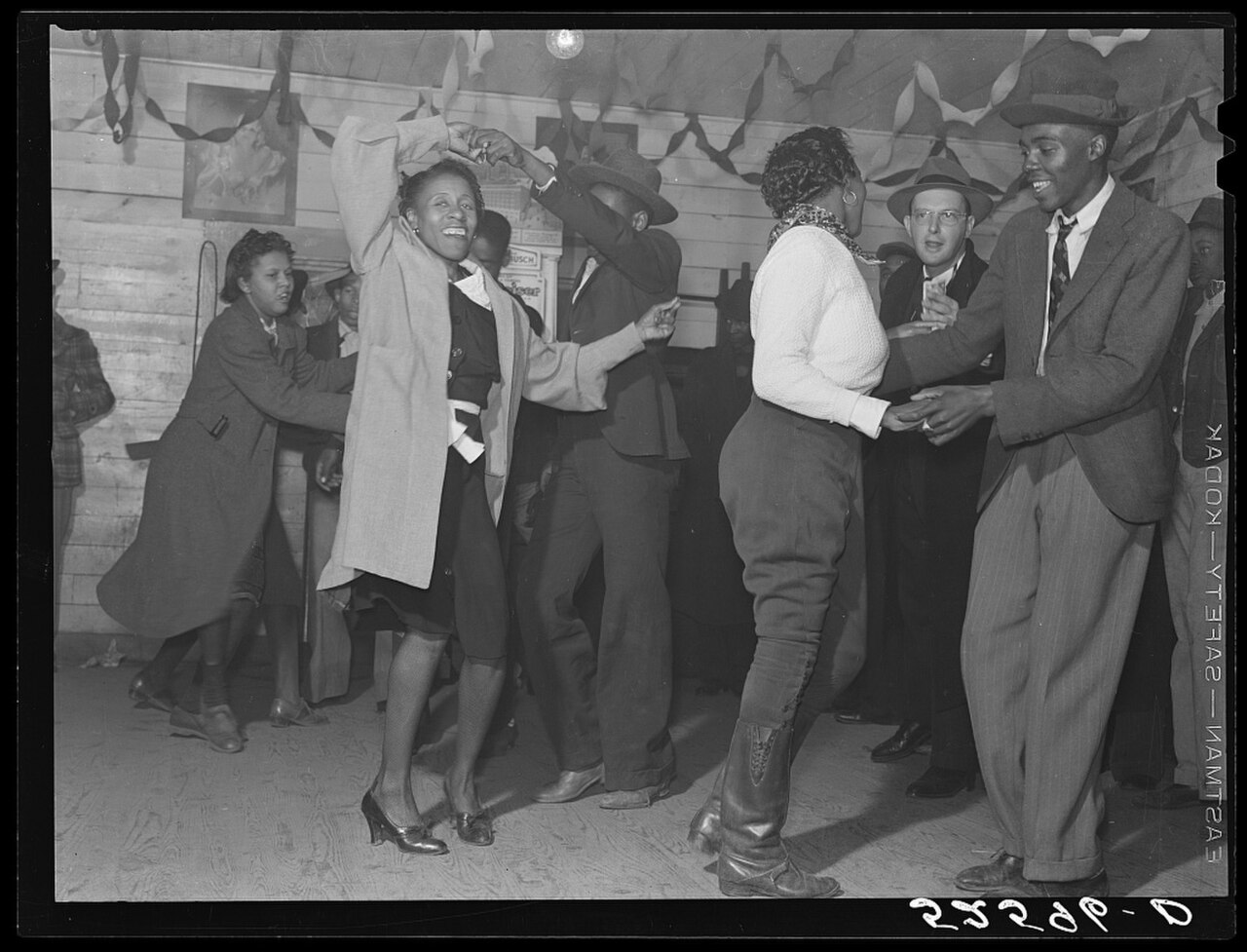 Original caption: "Jitterbugging in Negro juke joint, Saturday evening, outside Clarksdale, Mississippi Delta
"