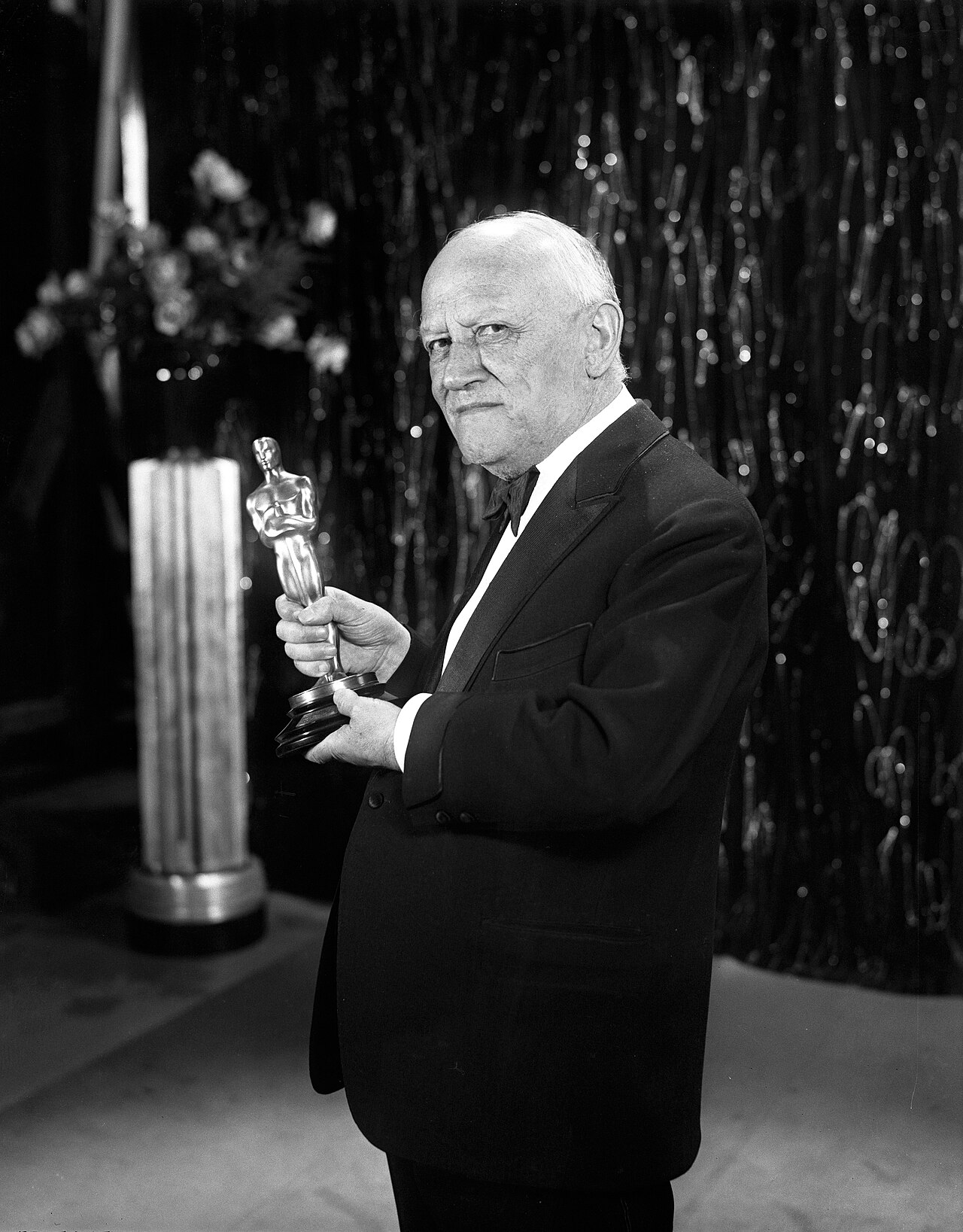 Carl Laemmle holding the Oscar trophy in 1930, probably  for All Quiet on the Western Front, produced by his son Carl Laemmle Jr. on Universal Pictures
